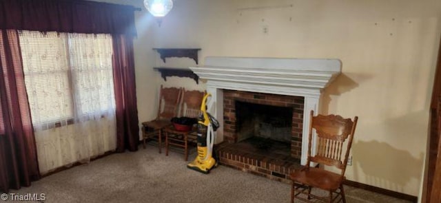 living area with a fireplace and carpet floors