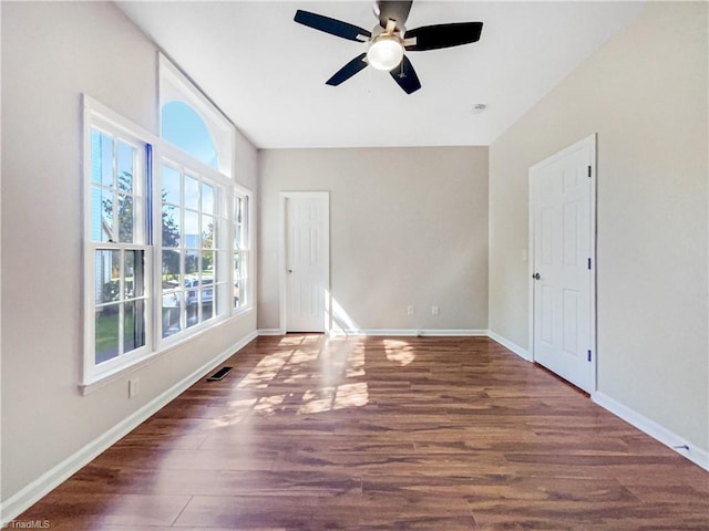 unfurnished room featuring ceiling fan and dark hardwood / wood-style floors