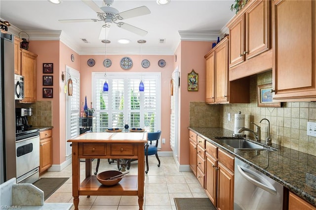 129 Turnbuckle Ct, Clemmons, NC 27012 - kitchen with appliances with stainless steel finishes, a ceiling fan, tasteful backsplash, light tile patterned floors, and dark stone counters
