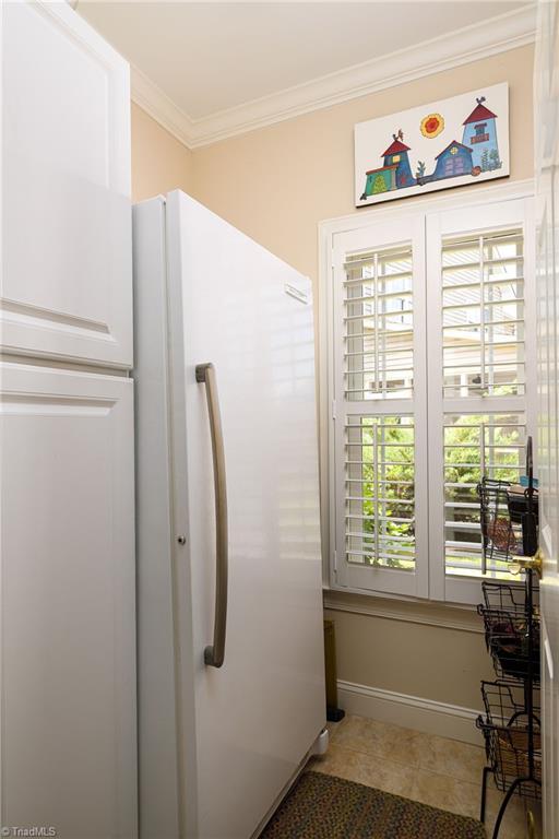 129 Turnbuckle Ct, Clemmons, NC 27012 - bathroom with ornamental molding and tile patterned flooring