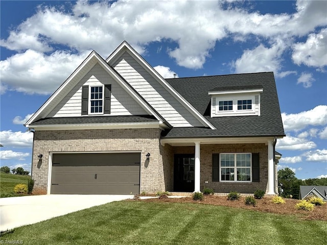 308 Grandworth Way, King, NC 27021 - craftsman-style house featuring brick siding, concrete driveway, a front lawn, and a shingled roof