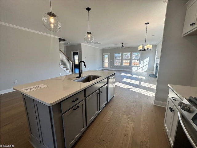 308 Grandworth Way, King, NC 27021 - kitchen with a sink, stainless steel dishwasher, range, gray cabinetry, and open floor plan