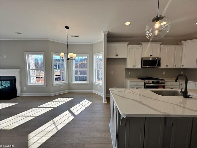 308 Grandworth Way, King, NC 27021 - kitchen featuring stainless steel appliances, wood-type flooring, a sink, white cabinets, and recessed lighting