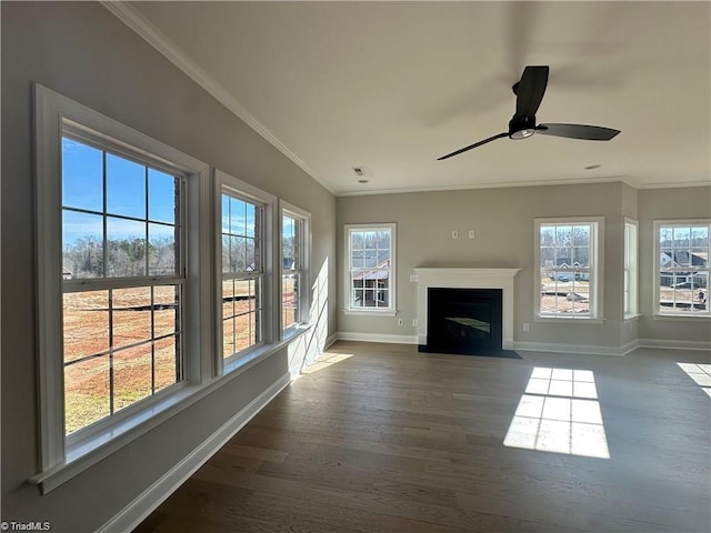 308 Grandworth Way, King, NC 27021 - unfurnished living room featuring baseboards, dark wood-type flooring, crown molding, a ceiling fan, and a fireplace with flush hearth