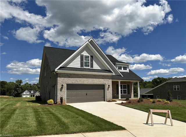 308 Grandworth Way, King, NC 27021 - craftsman-style home with concrete driveway, a front lawn, a garage, and brick siding