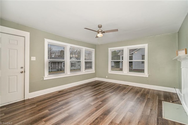 interior space featuring ceiling fan and dark wood-type flooring