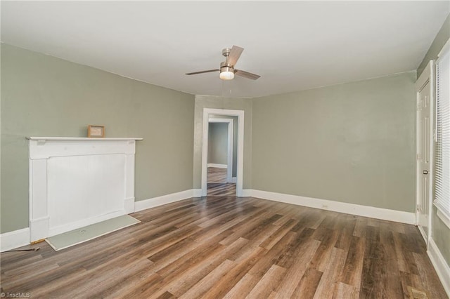 unfurnished living room featuring hardwood / wood-style floors and ceiling fan