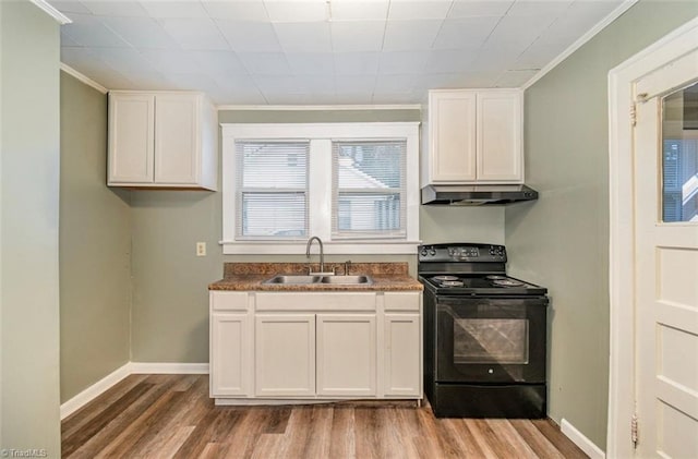 kitchen with black / electric stove, sink, white cabinets, and light hardwood / wood-style flooring