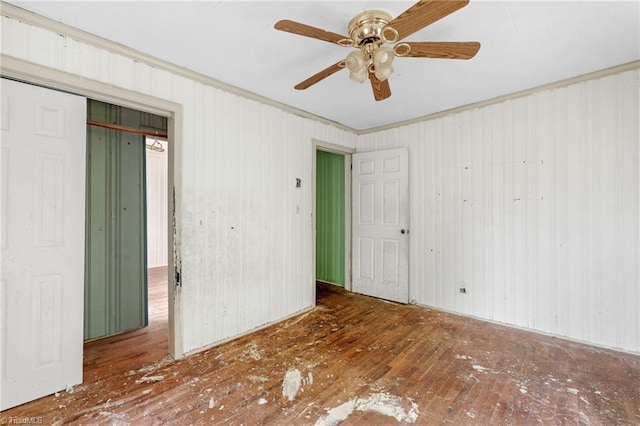 1198 Red Bank Rd, Germanton, NC 27019 - unfurnished bedroom with hardwood / wood-style floors, a closet, crown molding, and a ceiling fan