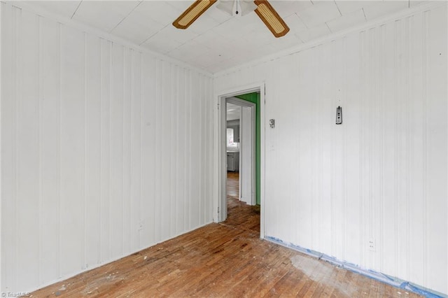 1198 Red Bank Rd, Germanton, NC 27019 - unfurnished room featuring wood-type flooring, ceiling fan, and wood walls