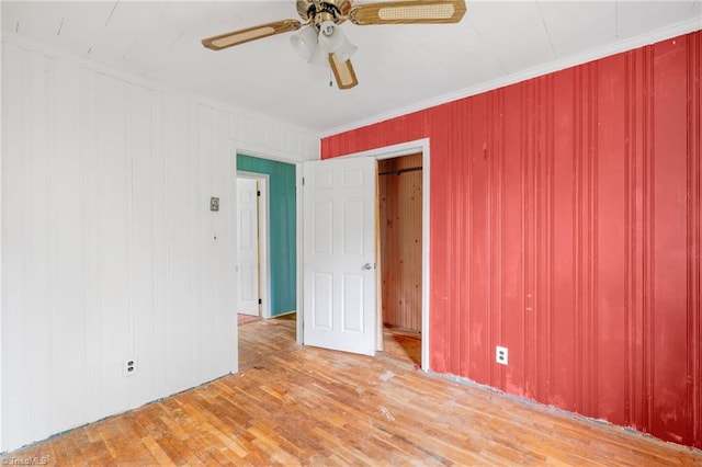1198 Red Bank Rd, Germanton, NC 27019 - empty room featuring a ceiling fan, wood finished floors, ornamental molding, and wooden walls