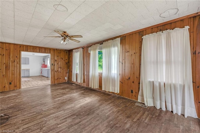 1198 Red Bank Rd, Germanton, NC 27019 - unfurnished room with ceiling fan, wood finished floors, and wooden walls
