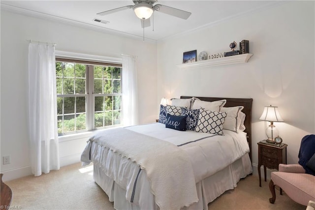 carpeted bedroom with multiple windows, ceiling fan, and crown molding