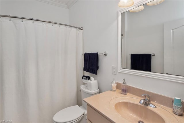 bathroom with vanity, toilet, ornamental molding, and a shower with shower curtain