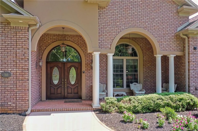 entrance to property featuring covered porch