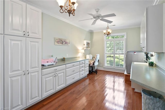 kitchen featuring ornamental molding, hardwood / wood-style floors, white cabinets, and ceiling fan with notable chandelier