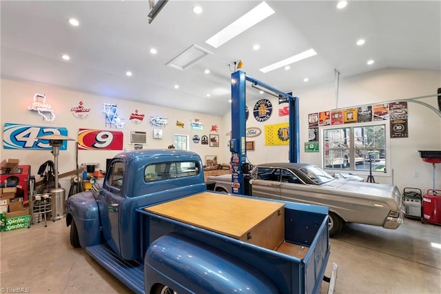 interior space featuring concrete floors and vaulted ceiling