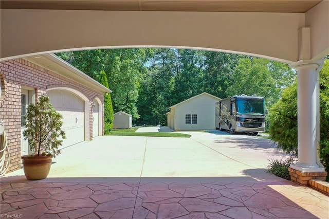 view of patio / terrace with a garage