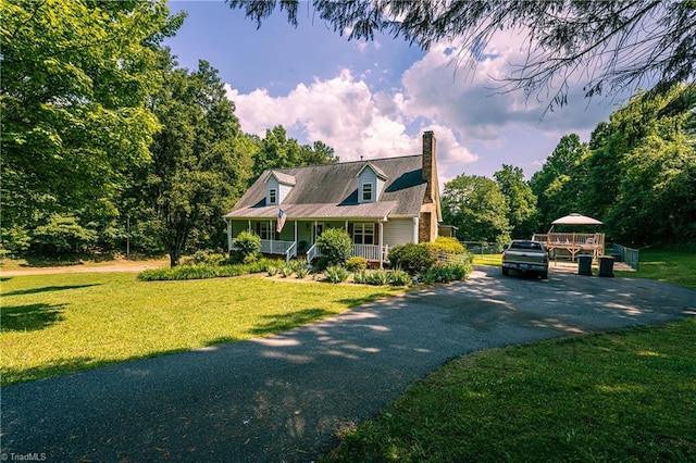 5750 Gayray St, Clemmons, NC 27012 - new england style home with a chimney, a porch, asphalt driveway, and a front lawn