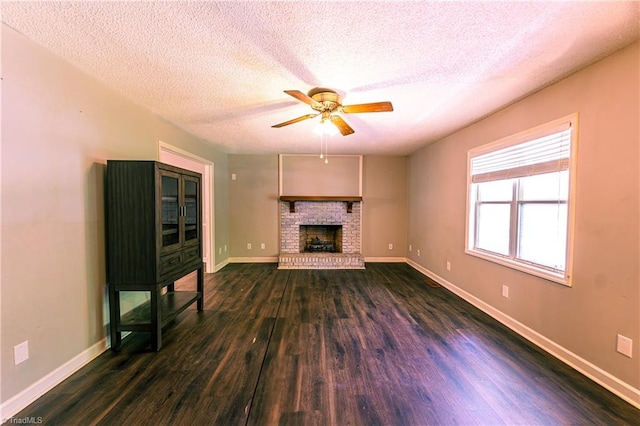 5750 Gayray St, Clemmons, NC 27012 - unfurnished living room with a ceiling fan, a textured ceiling, dark wood finished floors, and a fireplace