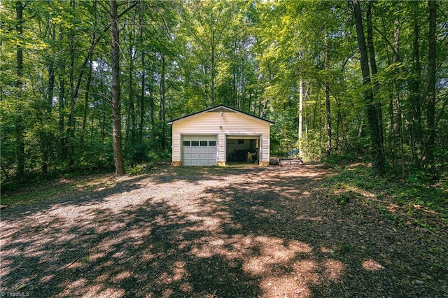 5750 Gayray St, Clemmons, NC 27012 - detached garage featuring a view of trees