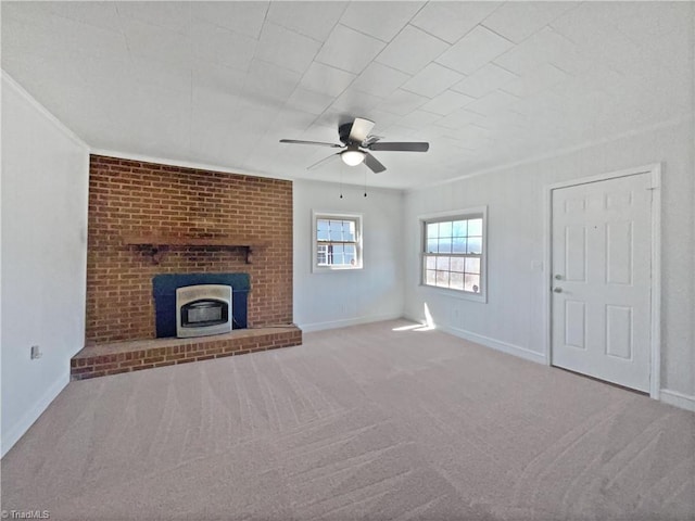 unfurnished living room featuring carpet flooring, baseboards, and a ceiling fan