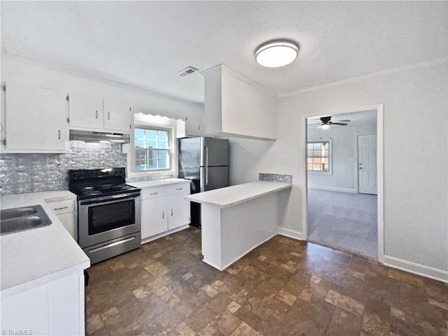 kitchen with visible vents, under cabinet range hood, light countertops, a peninsula, and stainless steel appliances