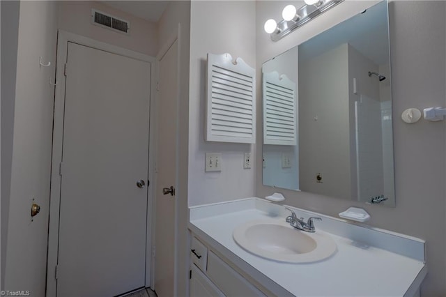 bathroom featuring vanity and walk in shower