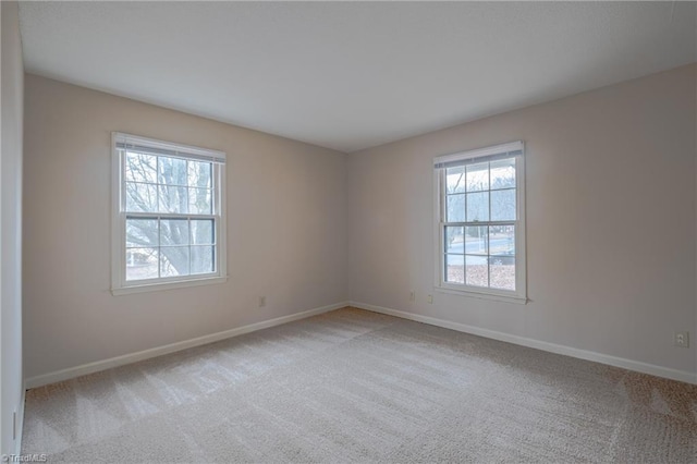 empty room featuring light colored carpet