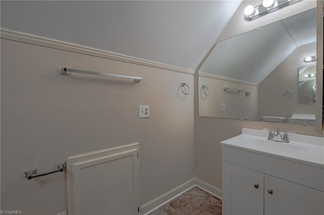 bathroom featuring lofted ceiling, vanity, and tile patterned flooring