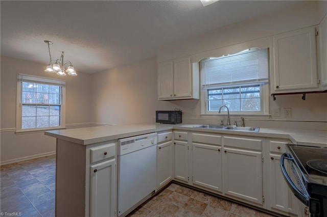 kitchen with sink, black appliances, white cabinets, decorative light fixtures, and kitchen peninsula