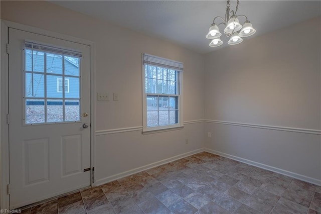 doorway featuring a chandelier