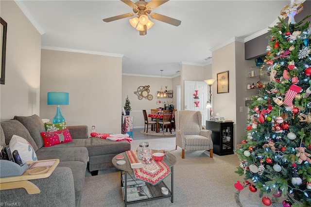 living room featuring carpet, ceiling fan, and ornamental molding