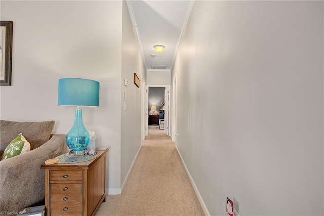 corridor with light carpet and ornamental molding