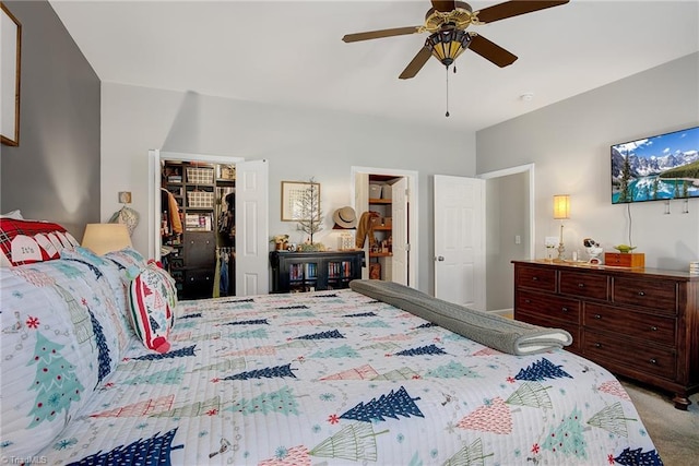 bedroom featuring ceiling fan, light colored carpet, and a closet