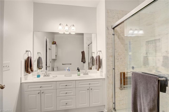 bathroom featuring vanity and a shower with shower door