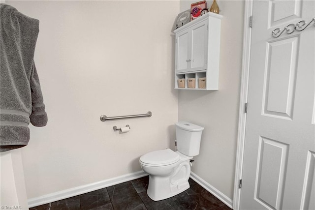 bathroom with tile patterned flooring and toilet