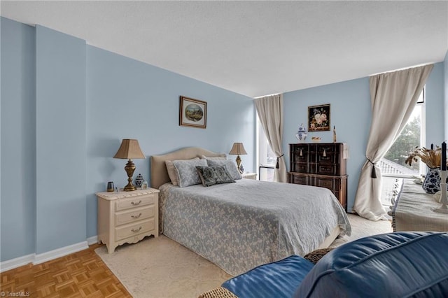 bedroom featuring light parquet flooring