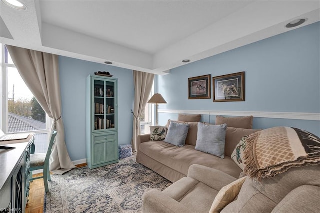 living room featuring parquet flooring