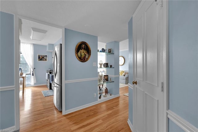 corridor featuring light hardwood / wood-style floors