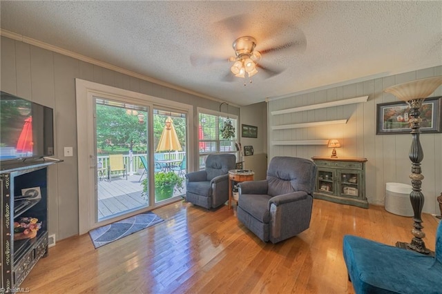 2205 Sedgemont Dr, Winston-Salem, NC 27103 - living area with wood finished floors, a textured ceiling, ceiling fan, crown molding, and built in shelves