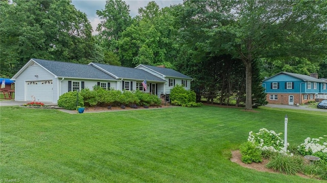 2205 Sedgemont Dr, Winston-Salem, NC 27103 - tri-level home featuring a front yard, an attached garage, driveway, and view of wooded area