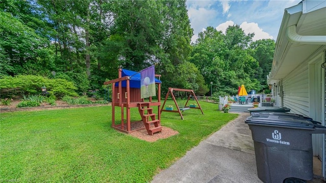 2205 Sedgemont Dr, Winston-Salem, NC 27103 - view of grassy yard featuring a playground and view of scattered trees