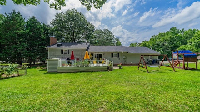 2205 Sedgemont Dr, Winston-Salem, NC 27103 - rear view of house featuring a chimney, a playground, a lawn, and a deck