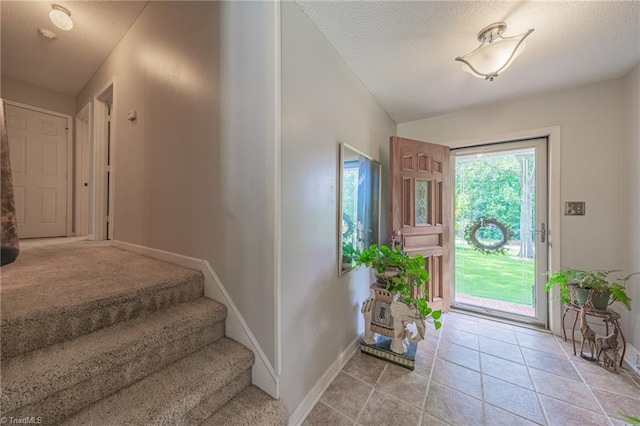 2205 Sedgemont Dr, Winston-Salem, NC 27103 - foyer featuring a textured ceiling and stairway