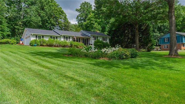 2205 Sedgemont Dr, Winston-Salem, NC 27103 - view of front facade featuring a front yard, view of scattered trees, and an attached garage
