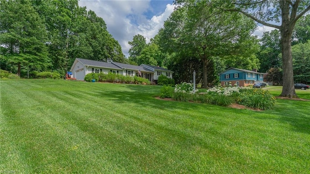 2205 Sedgemont Dr, Winston-Salem, NC 27103 - view of grassy yard featuring a garage and view of scattered trees