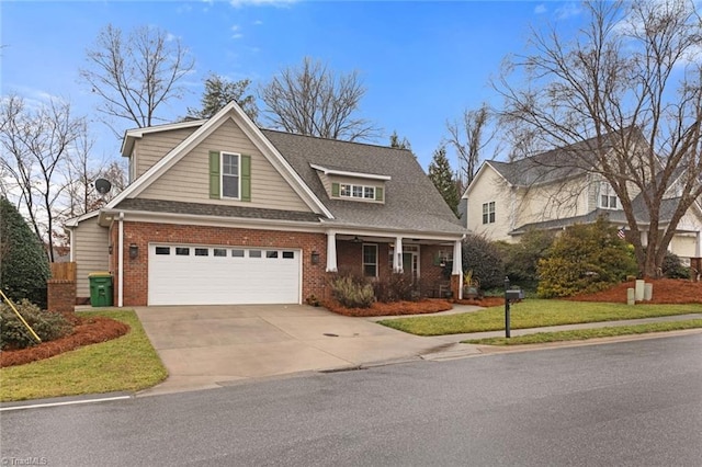 view of front of property featuring a garage and a front yard