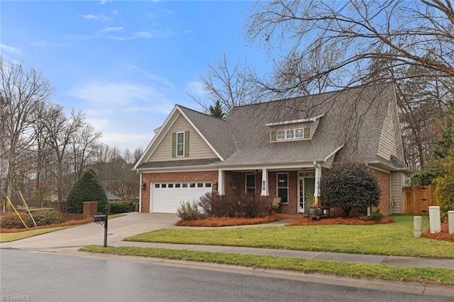 view of front of home with a garage and a front yard