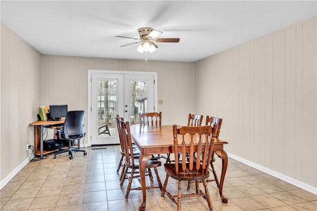 dining area with light tile patterned floors, french doors, baseboards, and a ceiling fan